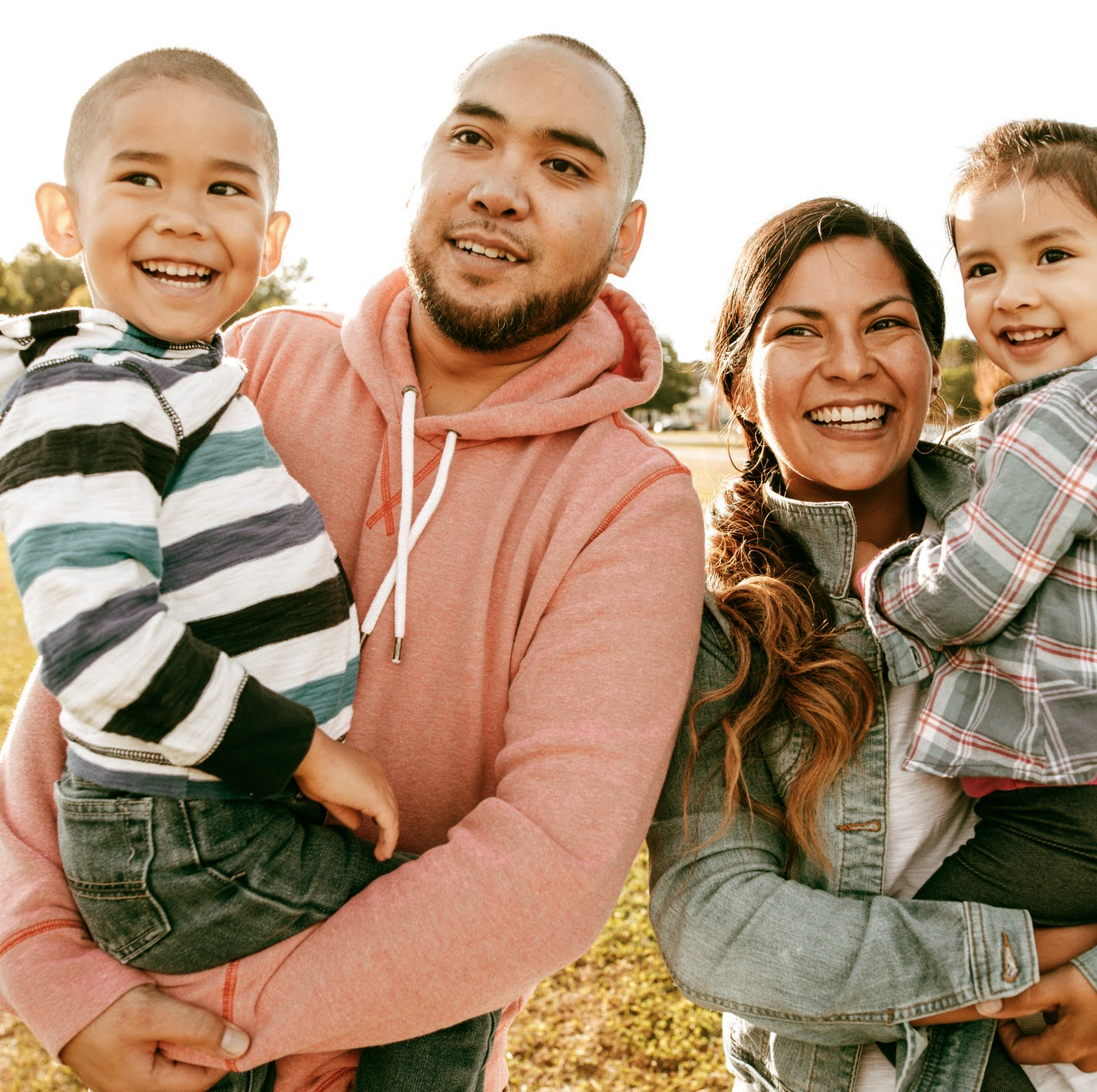 Family together outdoors in a park